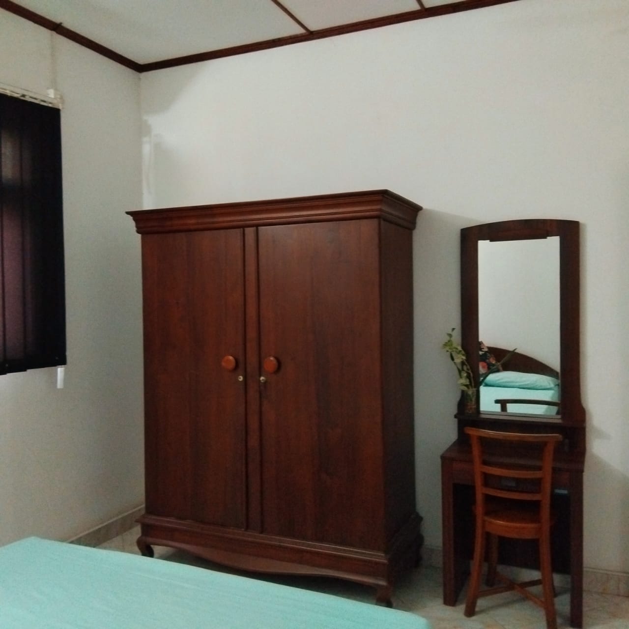 Bed by the large wardrobe